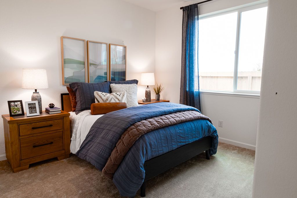 blue-bed-spread-staged-bedroom